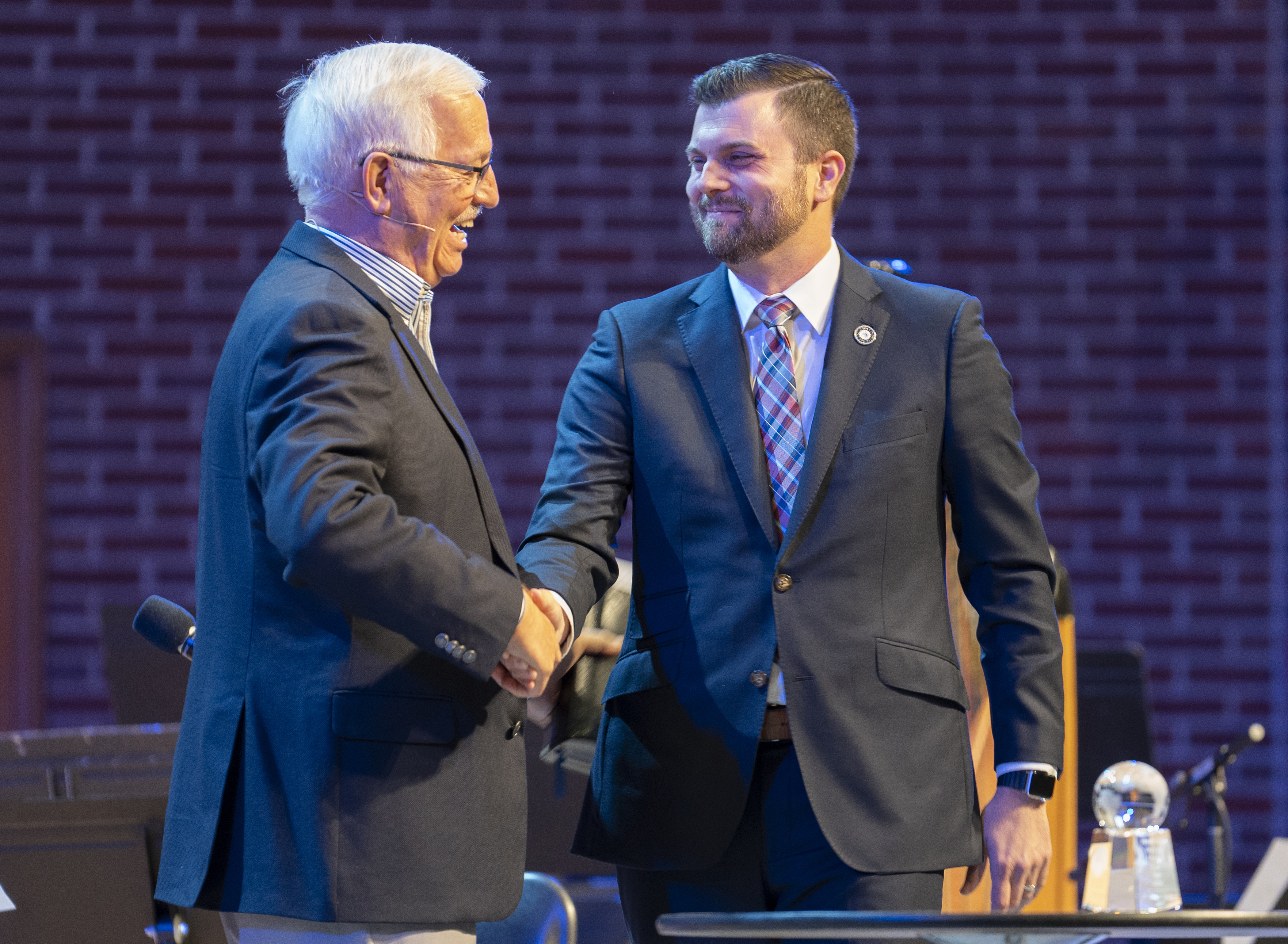 Jeff Bope (right), executive director of Moody’s Alumni Association (right), congratulates Dr. Dann Spader (left), founder of Concentric Global and Sonlife Ministries, at the 2024 Founder’s Week after being announced as the Alumnus of the Year.