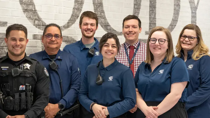 A group of Moody Bible Institute employees smiling