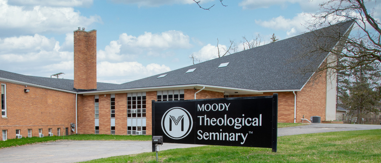 A brick building with a gray roof on Moody Theological Seminary's Michigan campus 